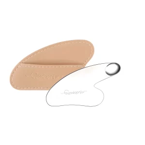 A heart-shaped stainless steel spatula with a beige PU leather protective case.